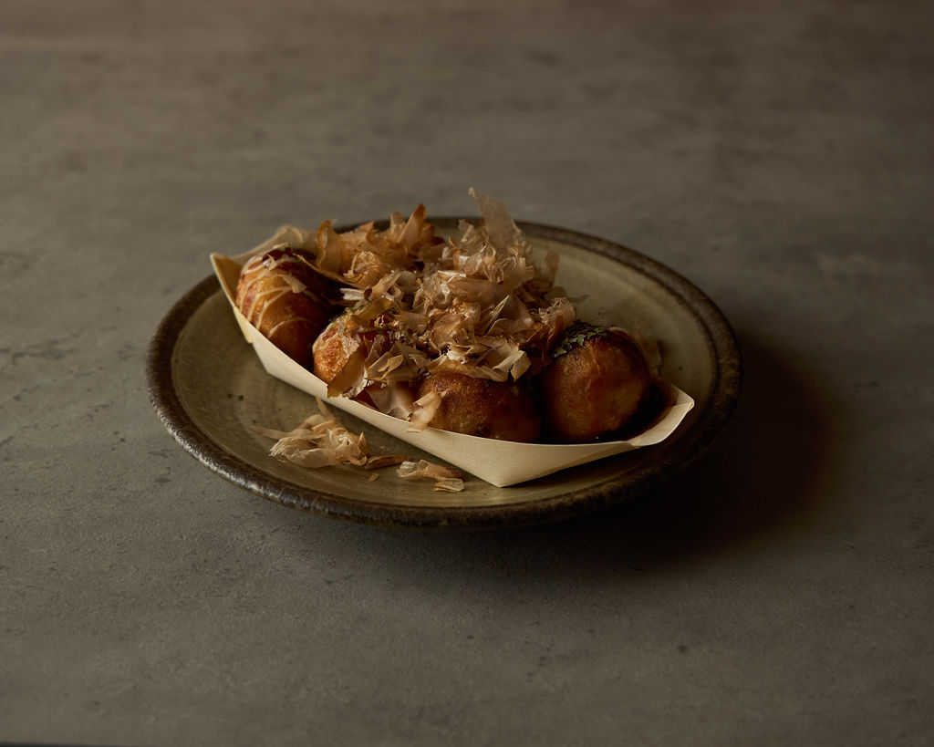 Takoyaki octopus balls with bonito flakes, mayo and takoyaki sauce